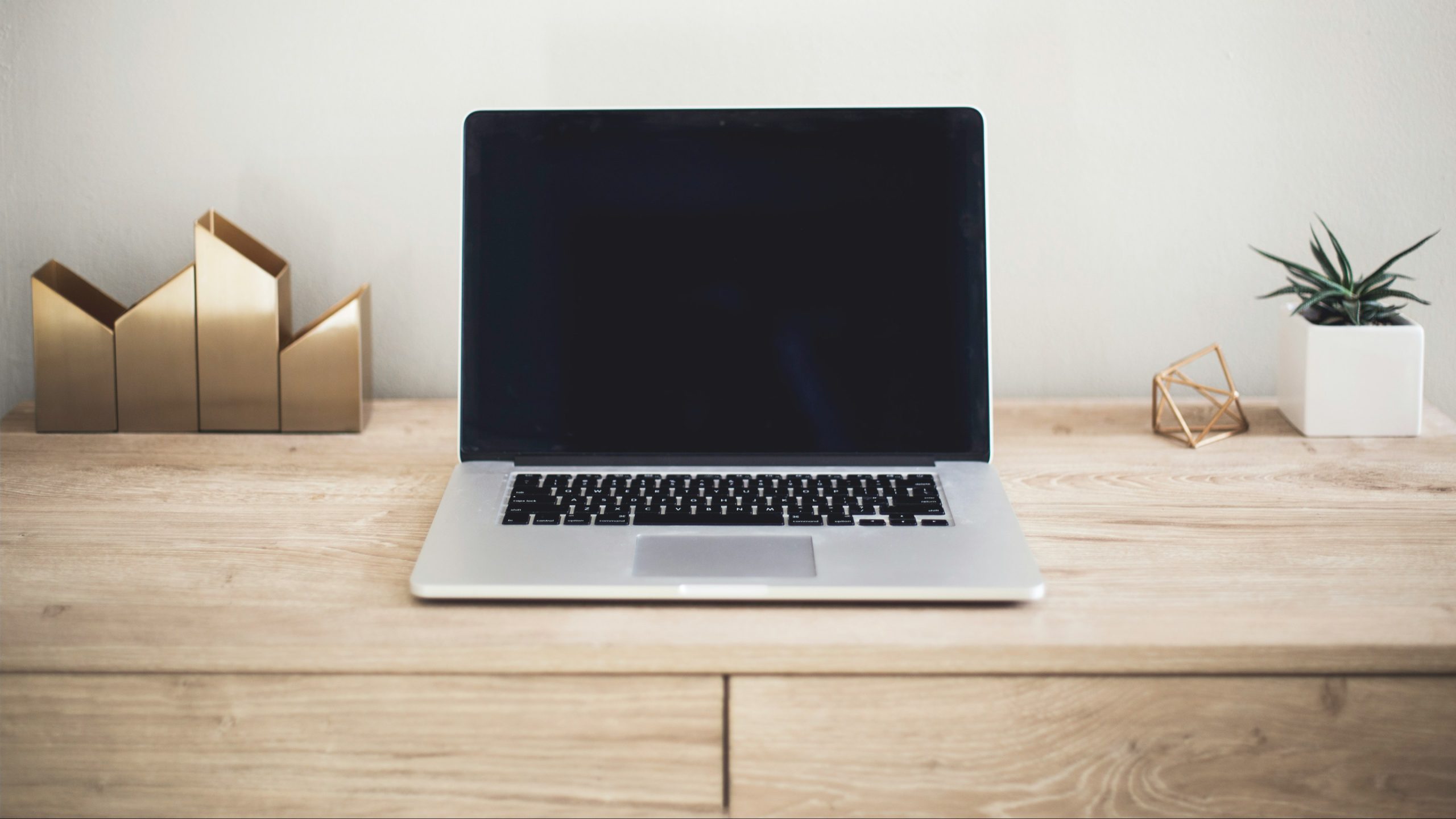 Laptop and workspace illustrating business technology
